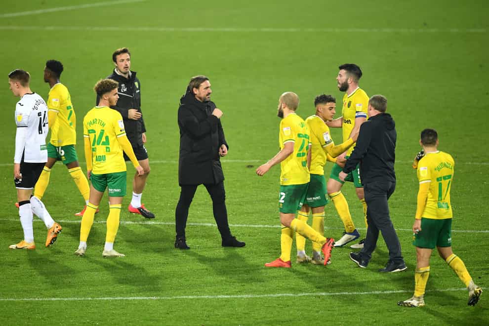 Norwich manager Daniel Farke celebrates with his players after beating Swansea