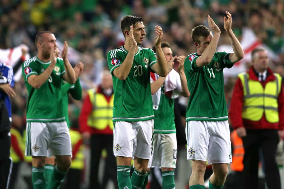 Craig Cathcart (centre) celebrates after Northern Ireland qualified for Euro 2016