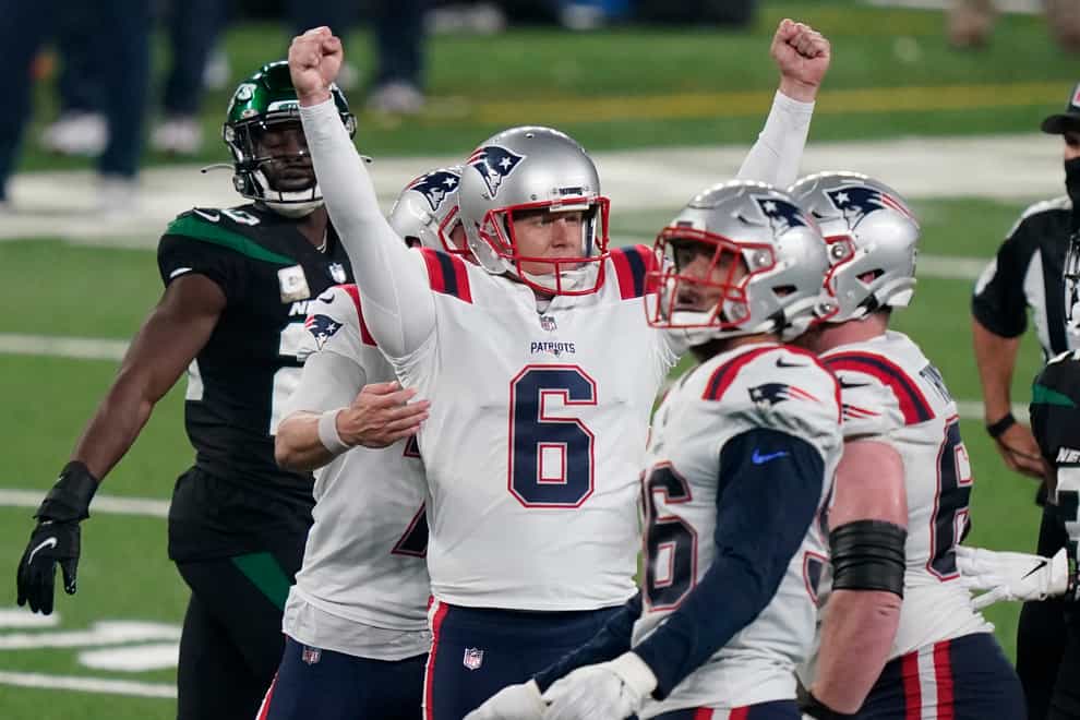 The New England Patriots' Nick Folk, centre, kicked the winning field goal against the New York Jets