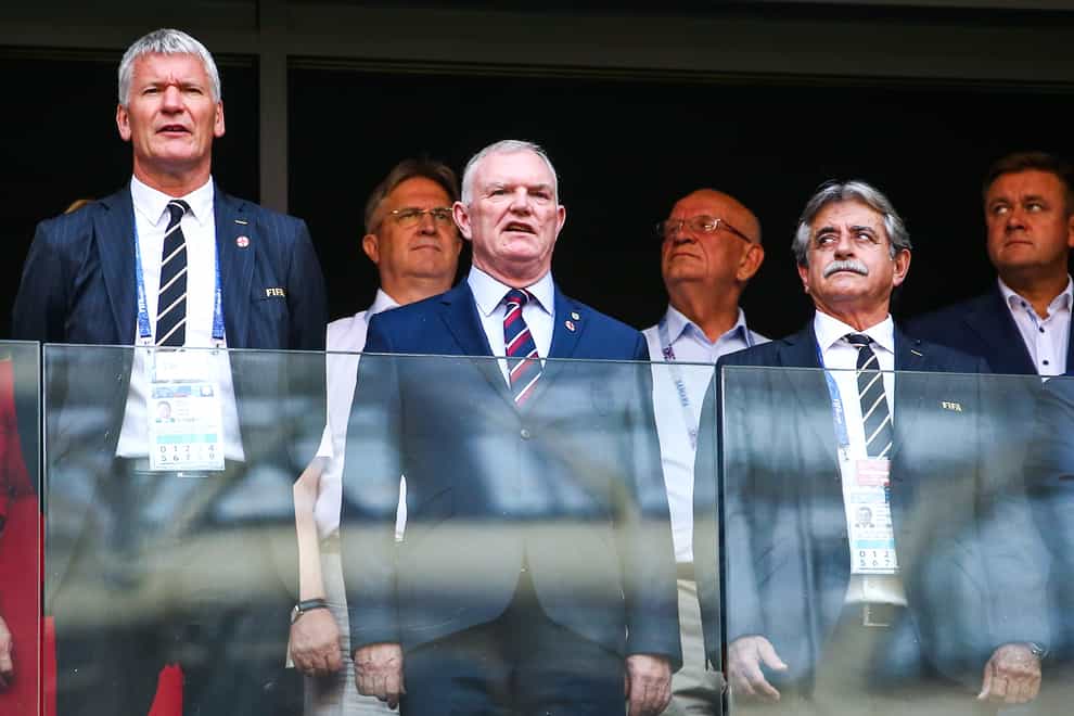 <p>FA chairman Greg Clarke (centre) apologised for using the word 'coloured' during an answer to MPs at a DCMS committee hearing</p>