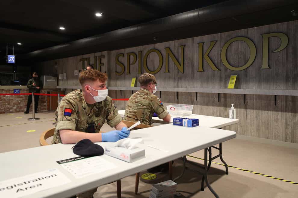 Members of the military use Anfield stadium as part of the mass testing taking place in the city of Liverpool (Peter Byrne/PA)
