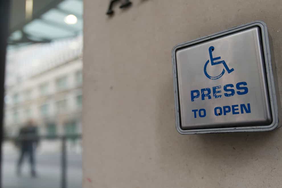 A wheelchair access door entry button