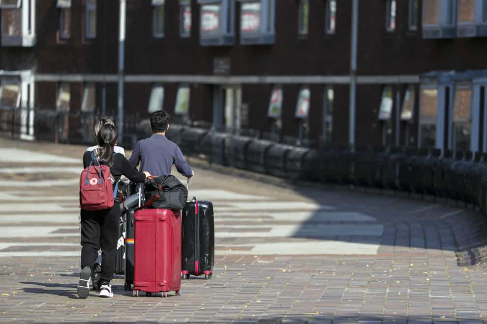 Students with suitcases