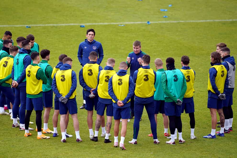 Republic of Ireland manager Stephen Kenny (centre right) and assistant Keith Andrews (centre left) speak to the players during their training