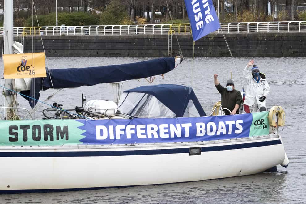 People take part in an All Hands On Deck: Action for Climate Justice protest along the River Clyde in Glasgow (Jane Barlow/PA)