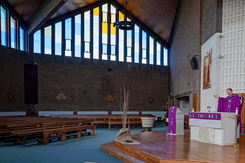 Father Stephen Pritchard at Our Lady of the Assumption Catholic church in Gateacre, Liverpool holds mass to an empty church (Peter Byrne/PA)