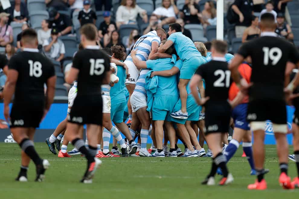 Argentina players celebrate beating New Zealand for the first time at the 30th attempt