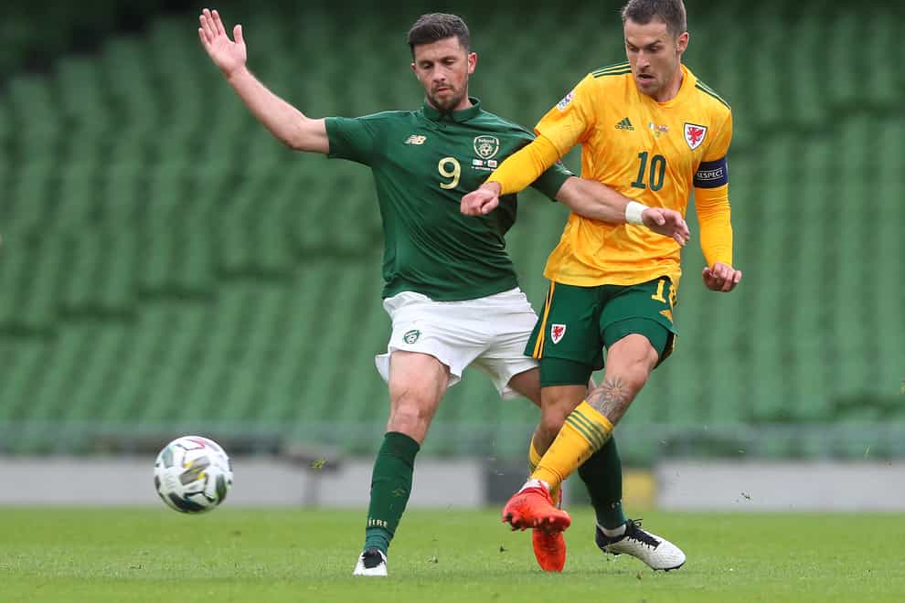 Shane Long (left) and Aaron Ramsey (right) in action during the Nations League tie between the Republic of Ireland and Wales in Dublin last month (Brian Lawless/PA)
