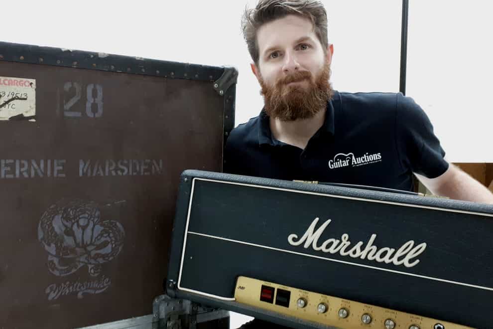 An auctioneer with a Marshall amp