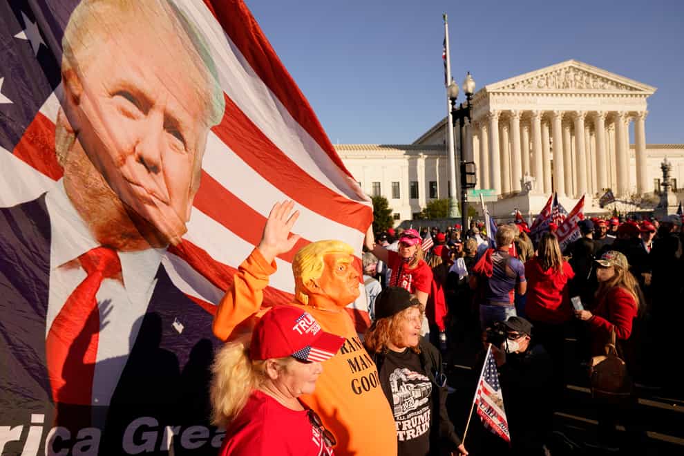 Supporters of US president Donald Trump march outside the Supreme Court building in Washington