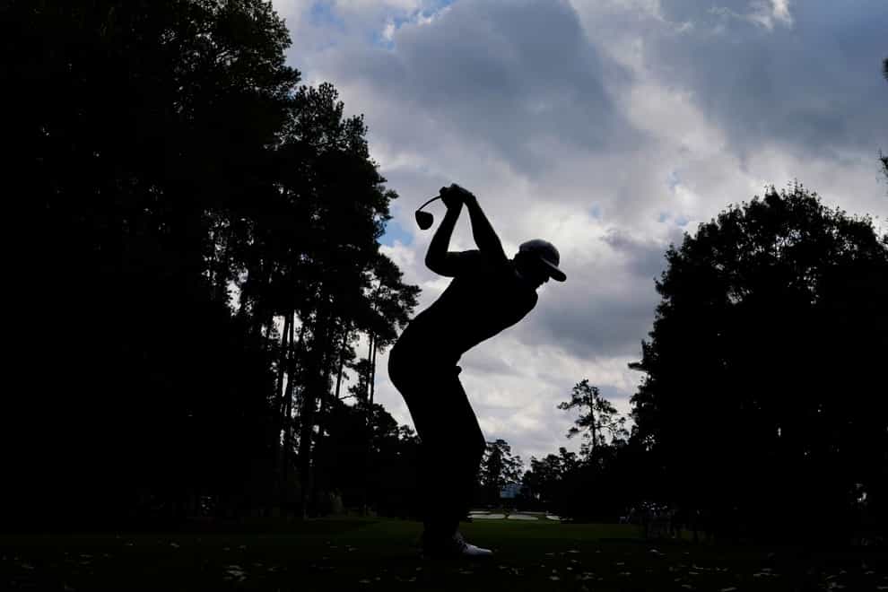 Dustin Johnson tees off on the seventh hole during the final round of the Masters