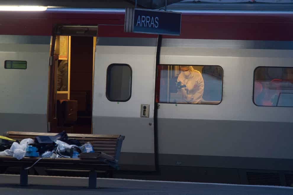 A police officer videos the crime scene inside a Thalys train at Arras train station, northern France, in 2015