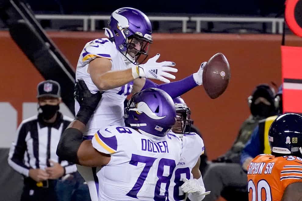<p>Minnesota Vikings wide receiver Adam Thielen is congratulated by teammate Dakota Dozier (78) after catching a touchdown pass during the second half against the Chicago Bears</p>