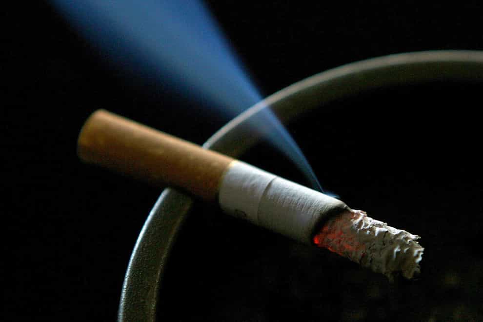 A cigarette burning on an ashtray