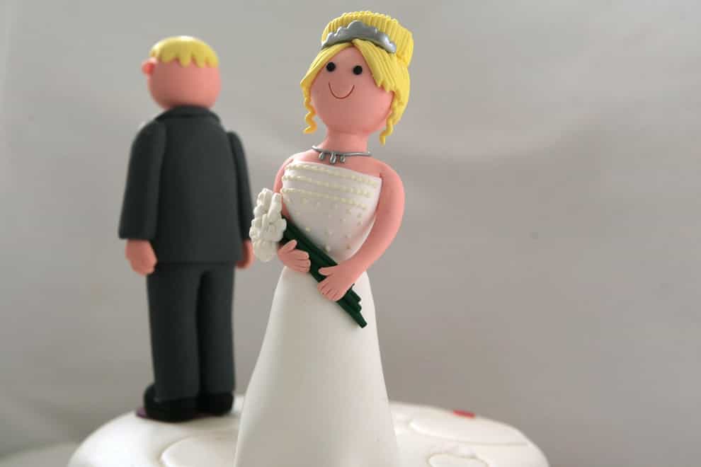 Bride and groom on a wedding cake