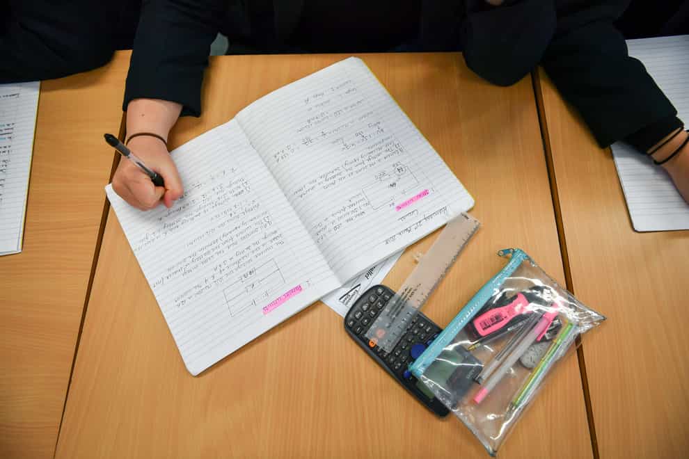 Students write in their exercise books