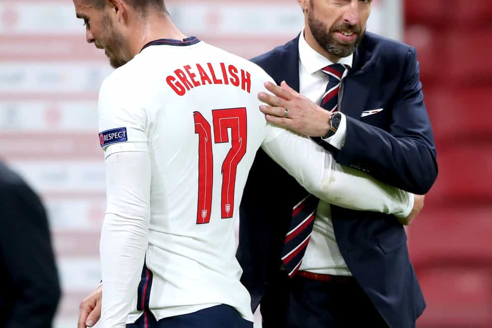 England manager Gareth Southgate, right, embraces Jack Grealish