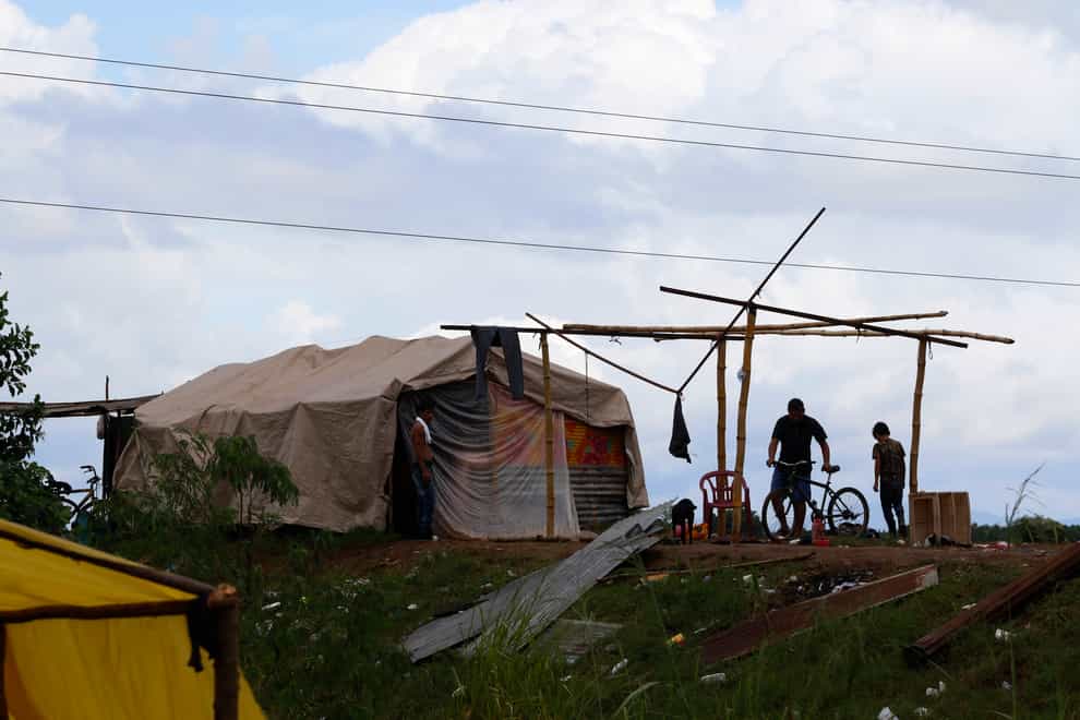 People living under precarious conditions make preparations before Hurricane Iota makes landfall in San Manuel Cortes, Honduras