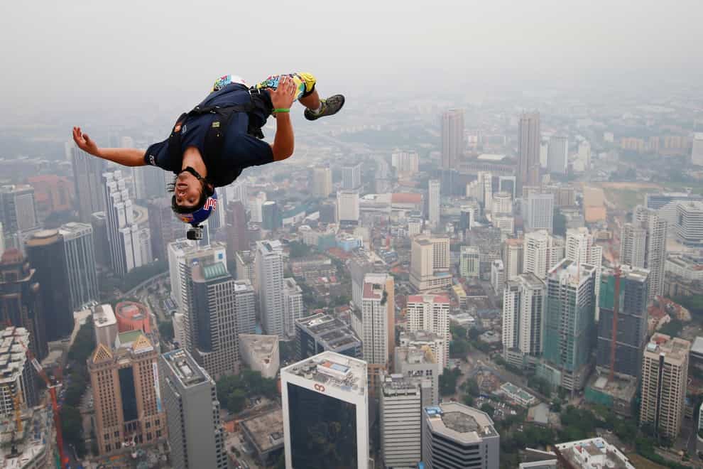 Base jumper Vince Reffet leaps from the 300-metre Open Deck of Malaysia’s landmark Kuala Lumpur Tower in 2013