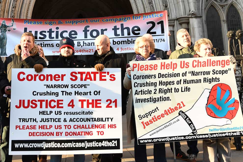 Protesters outside the High Court in London demanding justice for the 21 victims of the Birmingham pub bombings