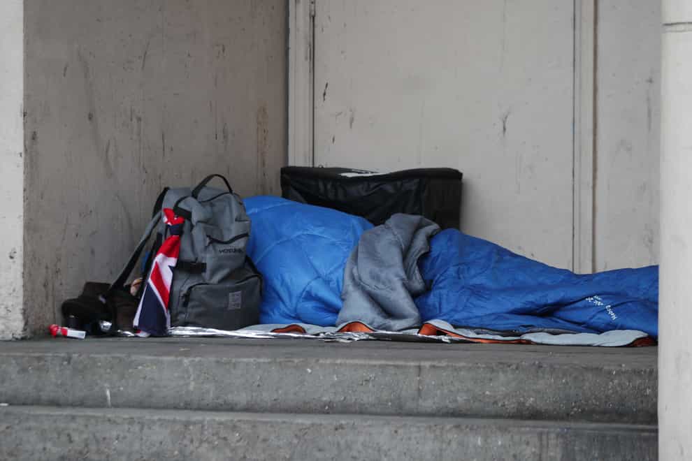A homeless person sleeping rough in a doorway in Farringdon, London