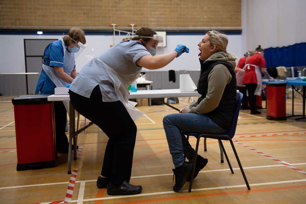A nurse administers a test at Dimensions Leisure Centre in Stoke-on-Trent (Jacob King/PA)