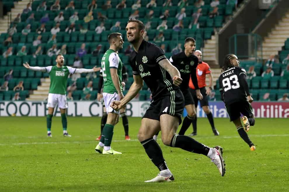 Shane Duffy celebrates Celtic's leveller scored by Diego Laxalt, background, at Hibs