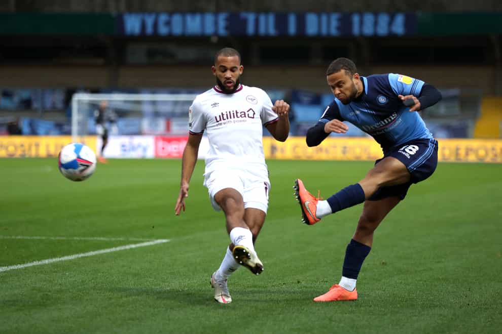 Brentford’s Bryan Mbeumo (left) was unable to find a way past the Wycombe defence