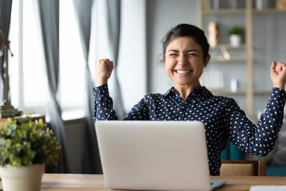 woman happy at a laptop