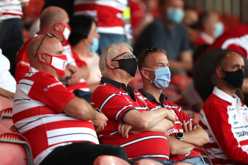 Gloucester fans wear masks at the Gallagher Premiership match against Harlequins at Kingsholm