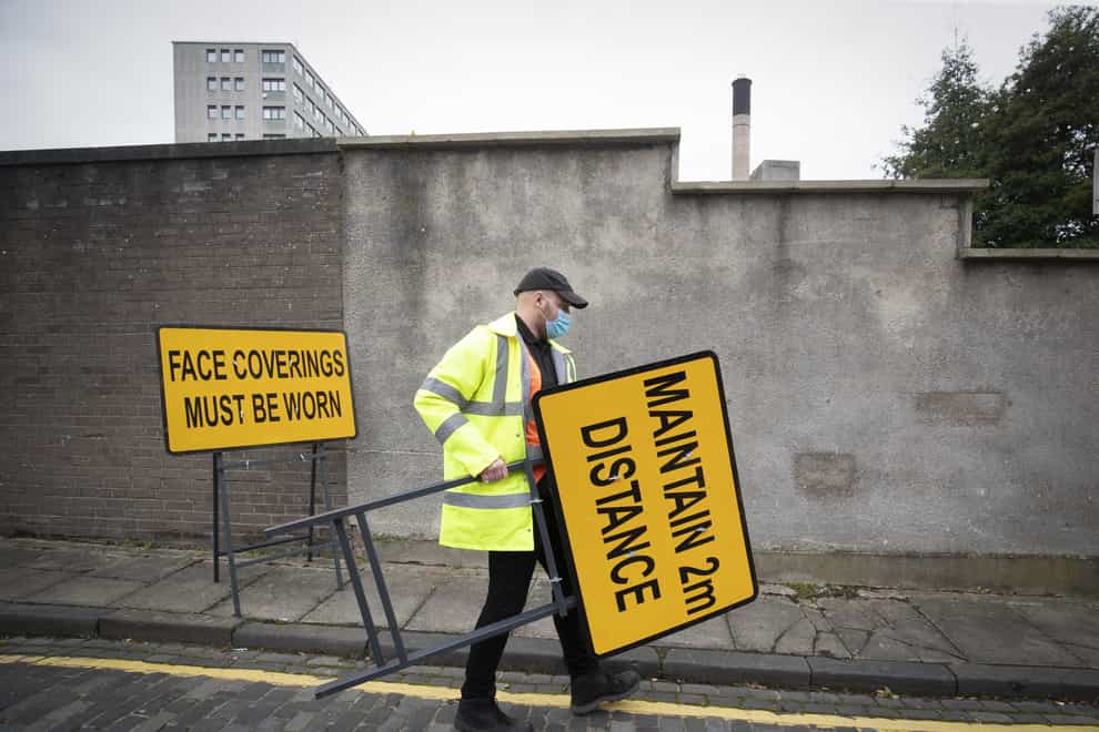 Signs are put in place at a walk-through Covid testing centre in Dundee