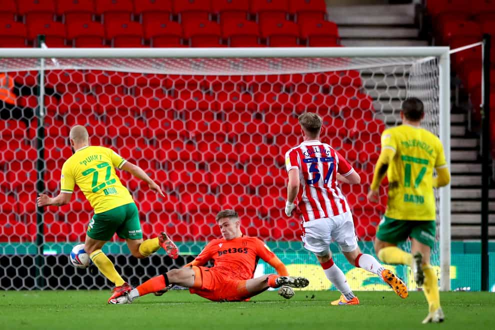 Norwich striker Teemu Pukki, left, nets his second of the game in the win at Stoke
