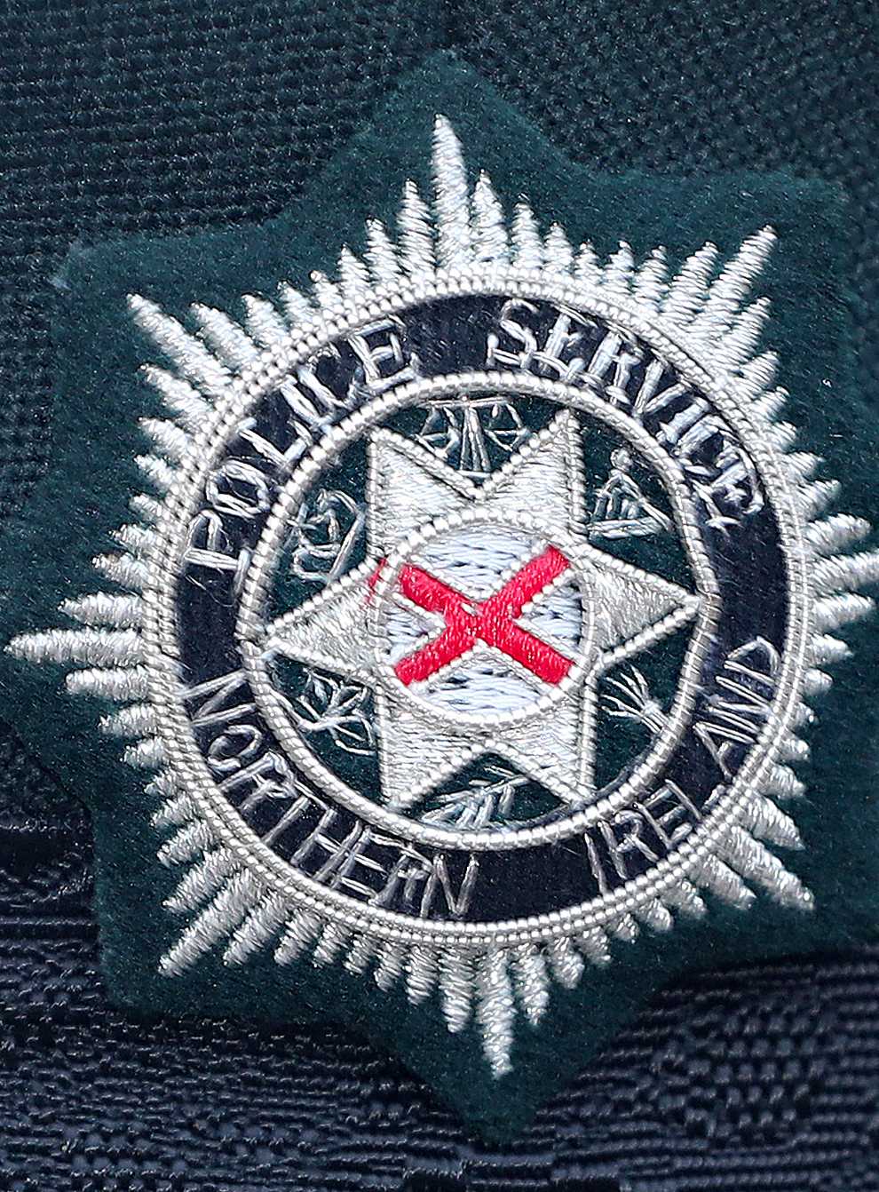 A Police Service of Northern Ireland logo badge