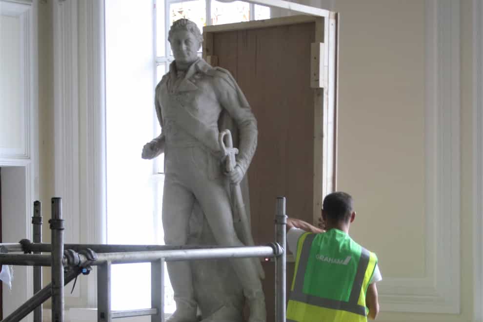 Contractors board up a statue of slave trader Sir Thomas Picton at Cardiff’s civic building