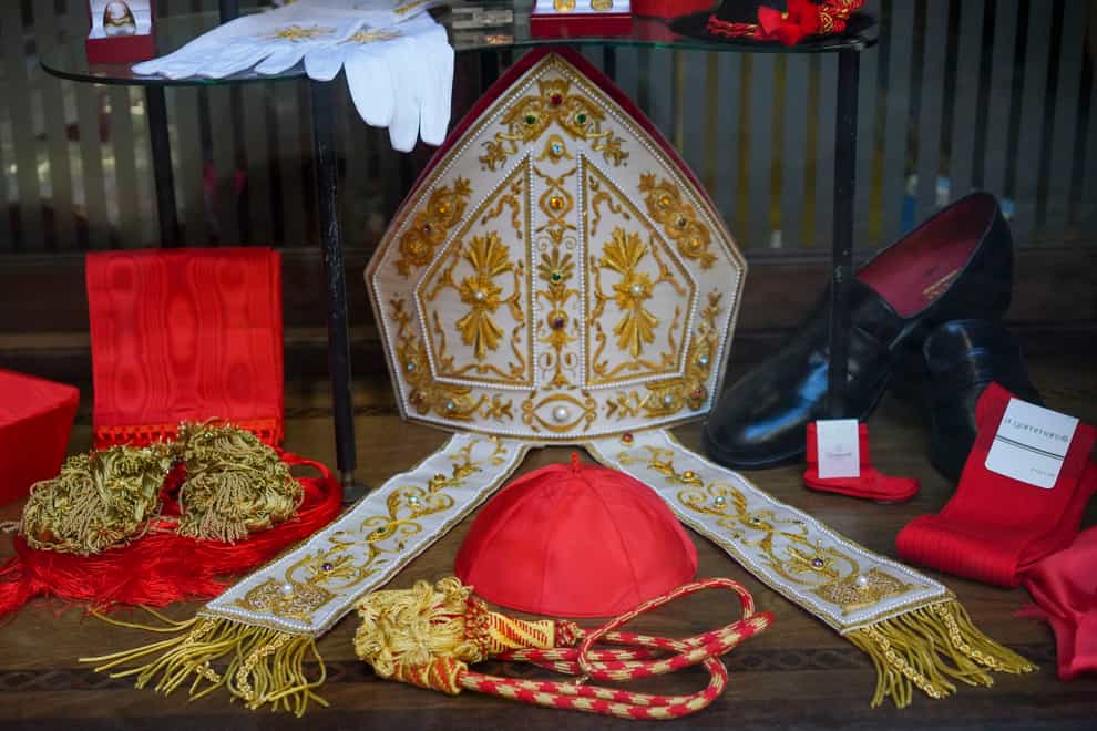 Cardinal clothing accessories are seen on display in the window of the Gammarelli clerical clothing shop, in Rome (Andrew Medichini/AP)