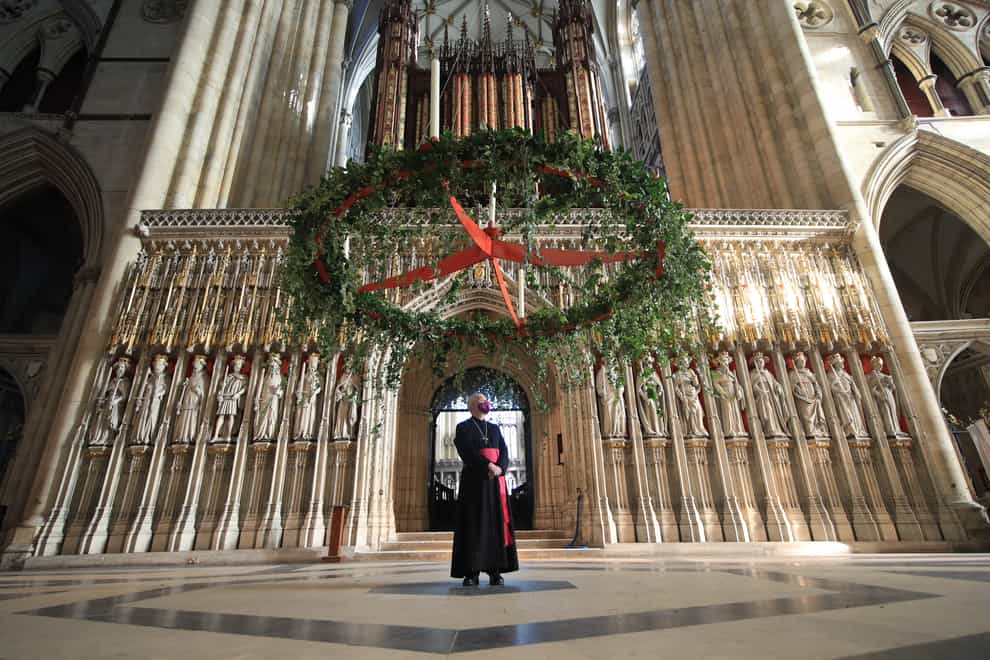 The Most Reverend Stephen Cottrell watches as the Advent wreath is raised to its traditional position (Danny Lawson/PA)