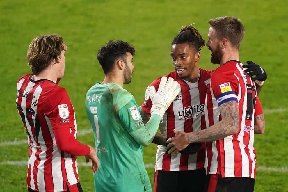 Ivan Toney, centre right, celebrates with team-mates after the final whistle