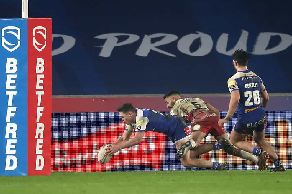 St Helens’ Jack Welsby, left, scores the winning try in the Super League Grand Final