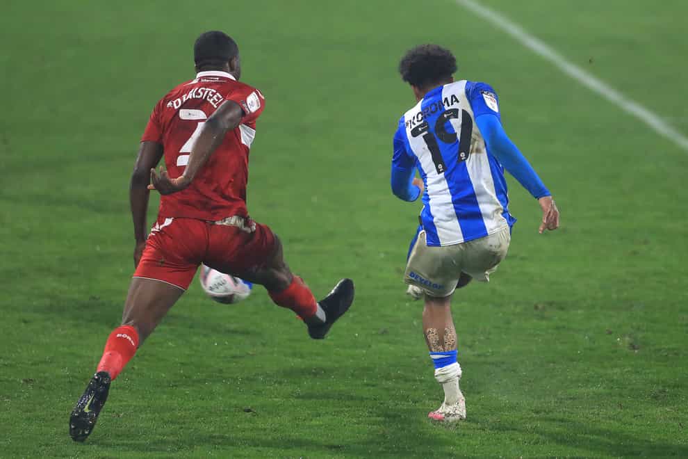 Huddersfield's Josh Koroma strikes the ball to score his side's winner.