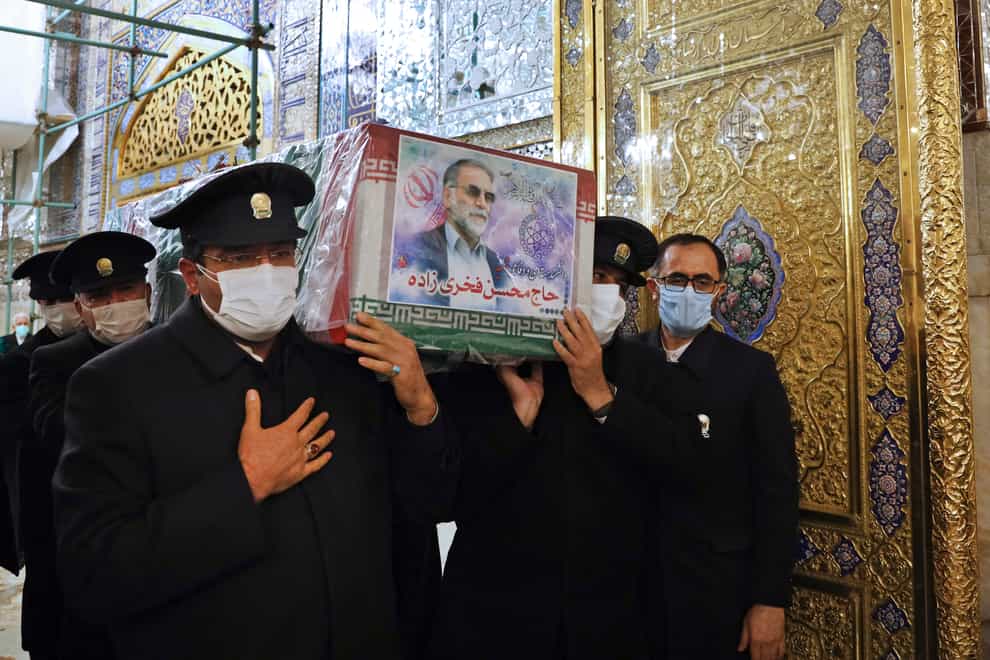 The coffin of Mohsen Fakhrizadeh is carried during a funeral ceremony in Mashhad, Iran
