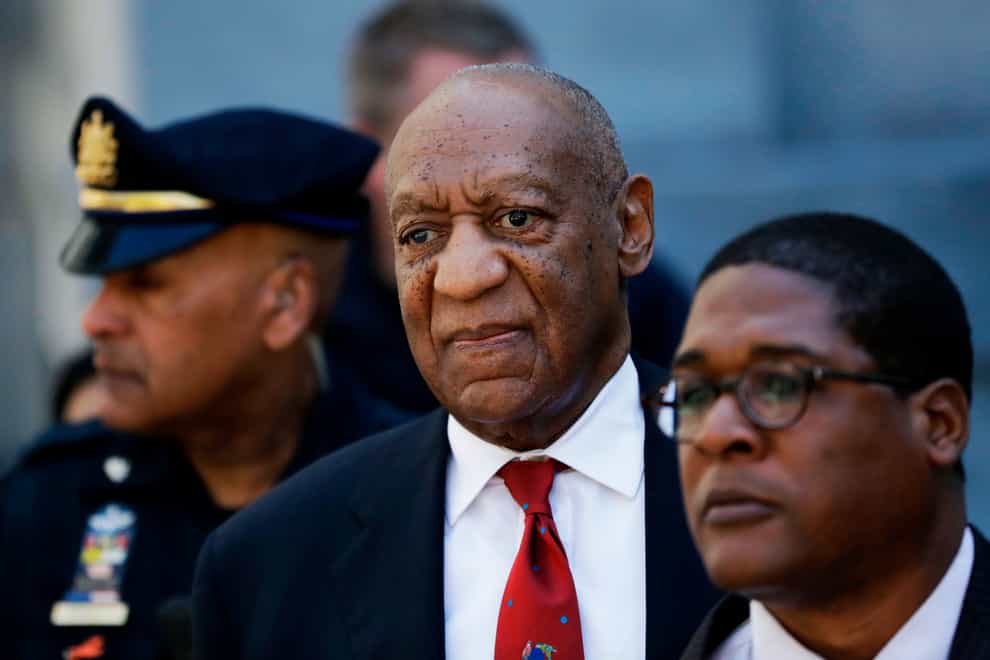 Bill Cosby, centre, leaves the the Montgomery County Courthouse in Norristown, Pennsylvania., after being convicted in 2018 (Matt Slocum/AP)
