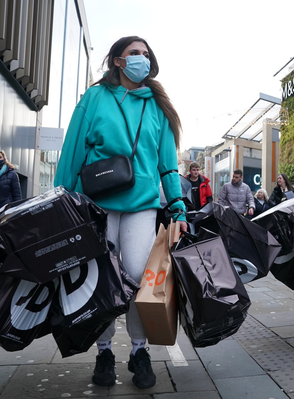 Shoppers laden with bags in Northumberland street, Newcastle (Owen Humphreys/PA)