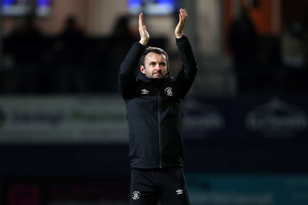Nathan Jones applauds the Luton fans at full-time