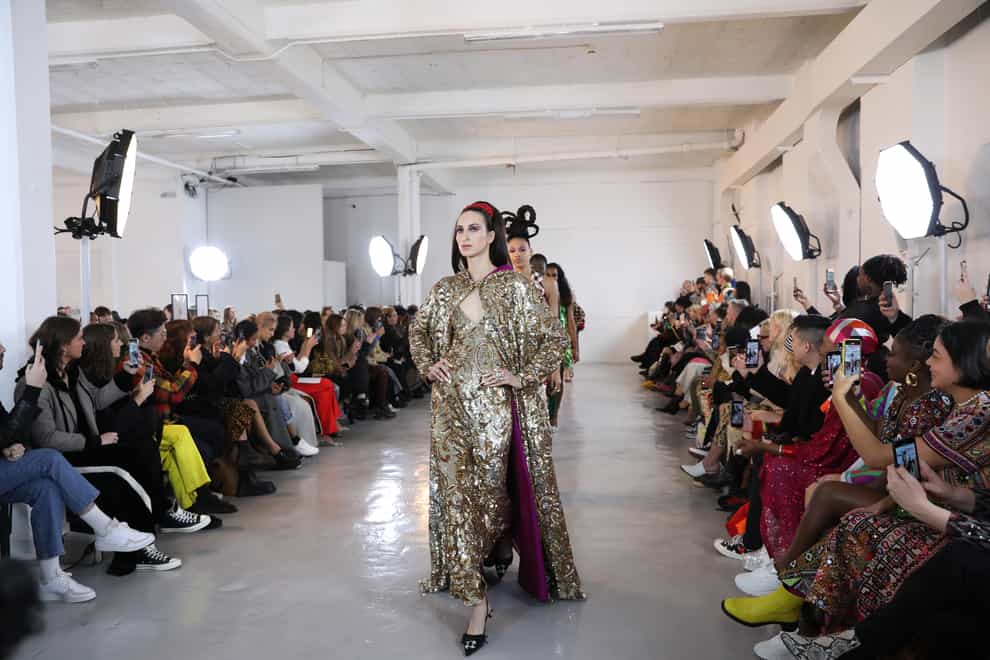 Models on the catwalk for the Ashish show at London Fashion Week February 2020 show at The Mess Hall in London.