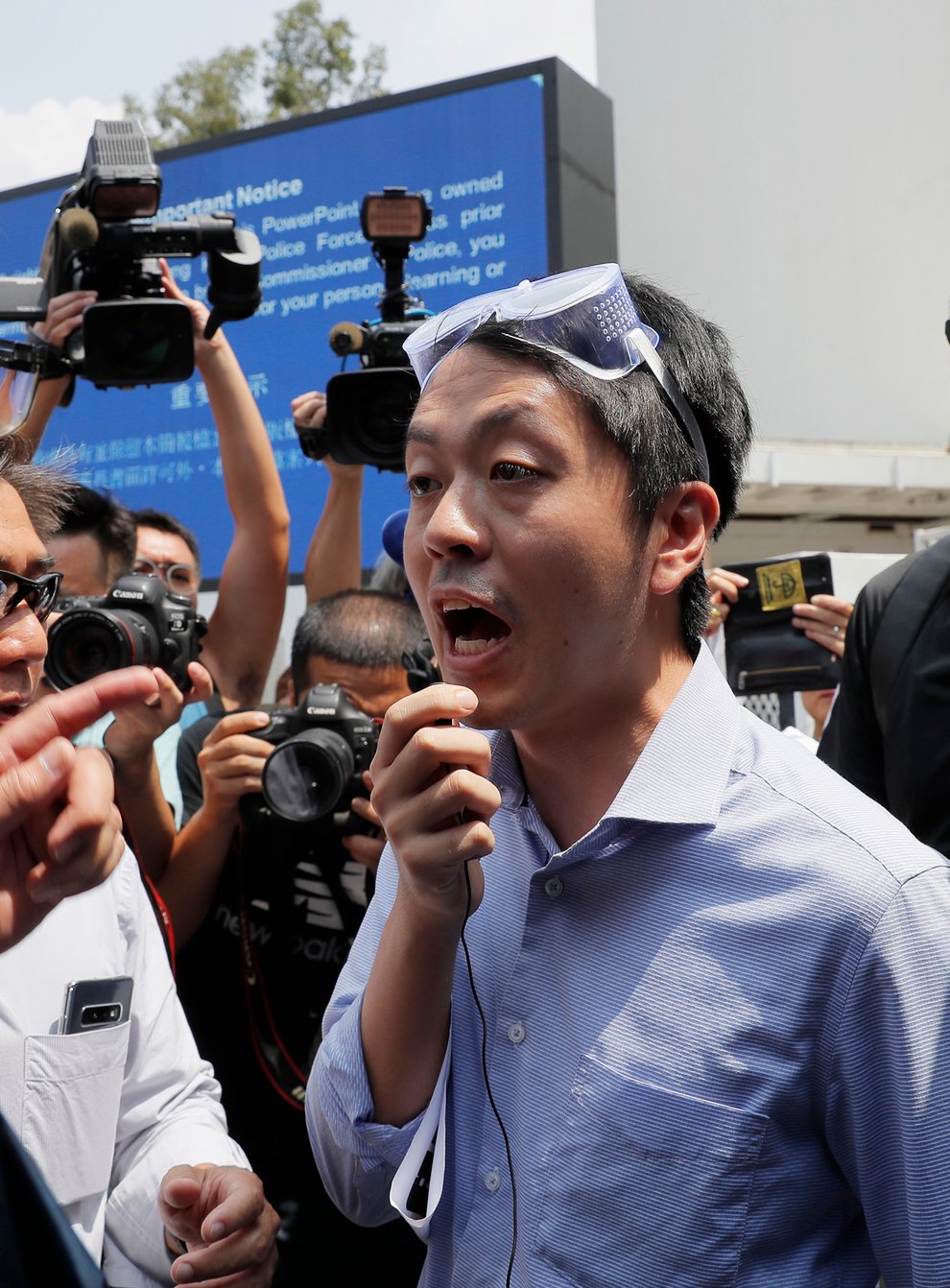 Ex-Hong Kong lawmaker plans to go into exile in Britain