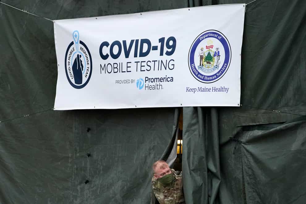 A member of the National Guard assisting at a Covid-19 mobile testing location in Auburn. Maine (Robert F. Bukaty/AP)