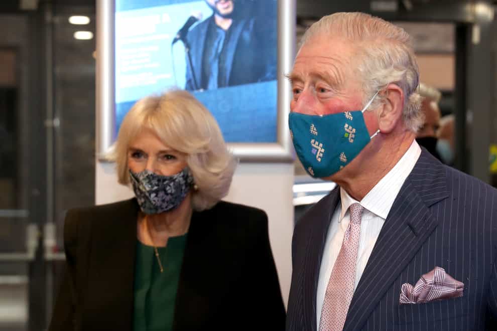 The Prince of Wales and Duchess of Cornwall, wearing masks, during a visit to the Soho Theatre in London. Chris Jackson/PA Wire
