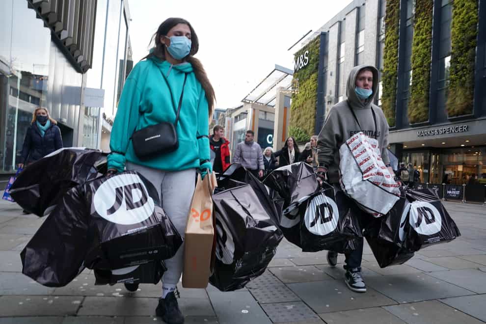 Shoppers laden with bags in Northumberland Street, Newcastle (Owen Humphreys/PA)