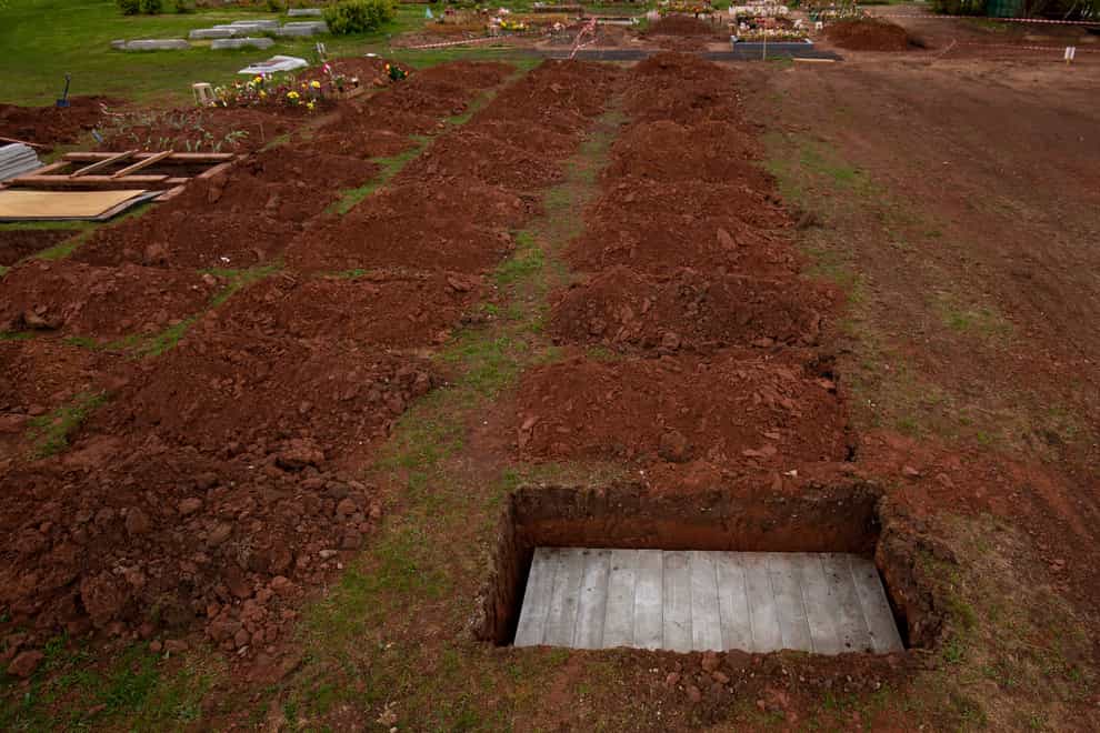Rows of new graves being prepared