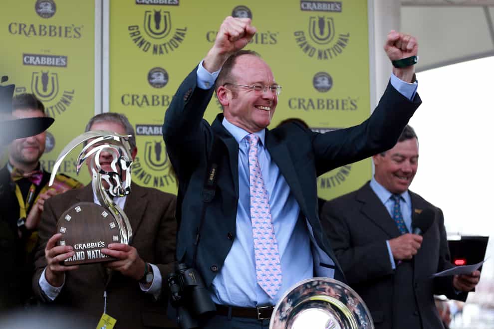 Dr Richard Newland celebrates his victory with Pineau De Re in the Grand National